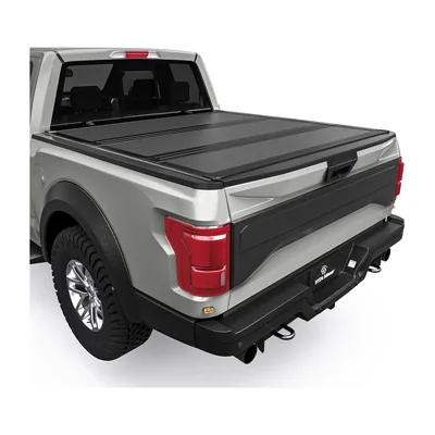 Low-profile hard tri-fold tonneau cover fitted to a pickup bed